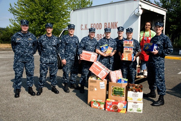 NUWC employees load food on the CK Food Bank truck.