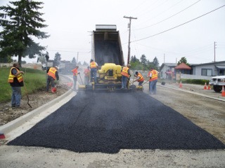 City of Bremerton crews pour pervious pavement in Bremerton near Homer Jones Drive and Schley Boulevard. The material is being embraced countywide as being an environmentally friendly alternative.