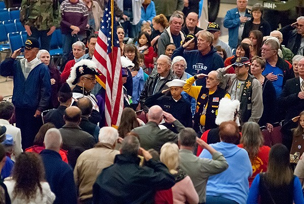 Veterans salute as the Knights of Columbus present the colors Nov. 11.