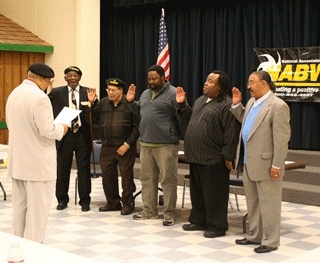 National Association for Black Veterans Regional Commander Harvey Brooks (left) installs the officers of the organization's Kitsap Peninsula Chapter Jan. 8 at the Kitsap Community Resources building on Park Avenue in Bremerton.