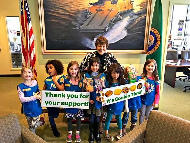 Bremerton Mayor Patty Lent poses with Girl Scouts with Bremerton Daisy troop 42186 in her office to kick off the Scouts’ annual cookie sale. Community booth sales begin March 3.