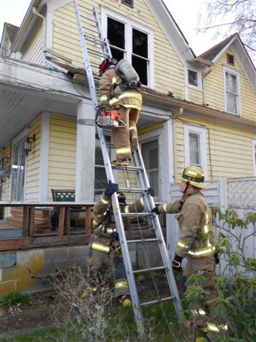 South Kitsap Fire and Rescue firefighters make their way to the second floor of a home on Hull Avenue where a one-room fire was reported.