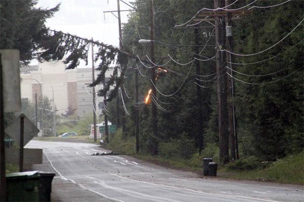 Suquamish Way was blocked between SR 305 and Totten Road Monday after a tree fell into a power line