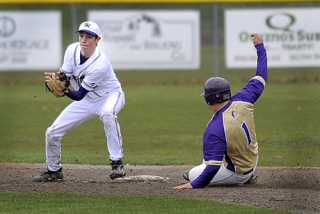 North Kitsap's Austin Abrahamson prepares to tag Sequim's Isaac Yamamoto at second base Monday in Poulsbo.