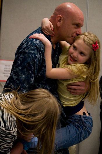 David Templeton holds onto his daughter