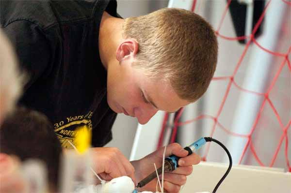 North Kitsap's Matt Moriarty works on his Remotely Operated Vehicle June 2 during the first Underwater Vehicle Competition at the Olympic High School Aquatic Center. Moriarty and Taylor Stracener finished second among competing teams.