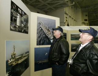 Cal Trock (left) served aboard the USS Kitty Hawk from 1976 to 1980 and Richard Trapp served on the warship from 1961 to 1963. The two men were among many veterans of the Kitty Hawk who turned out Thursday to visit the ship one last time before it is decommissioned this spring.