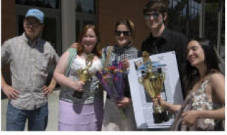 Olympic College student journalists (from left) Jon Miller