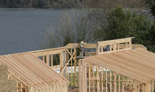 Workers from Kingston-based Whittles Construction work on the framing for a new wedding pavilion in Port Gamble Monday. The structure is the first new building in the community since the early 1900s.