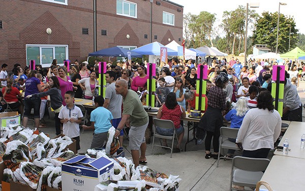 About 840 people signed up to receive a bag of school supplies.