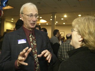 State Senate 23rd District nominee Phil Rockefeller (left) chats with Kim Churchill of Port Orchard after hearing the results of his 63.2 percent to 36.7 percent victory over Connie Lord Tuesday night at the Silverdale Beach Hotel.