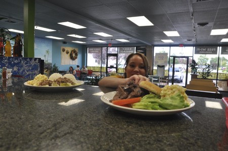 Rochelle Wagner prepares to run plates to customers at Aloha Kitchen in Silverdale. Wagner has been serving there since it opened in November.