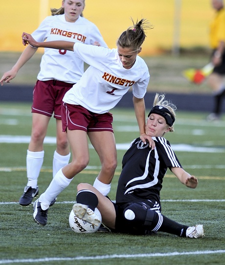 Kingston's Elizabeth Lawrence fights for the ball with Port Townsend's Megan Gambill Tuesday at the North Kitsap Stadium. Kingston won the match