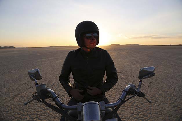 Filmmaker Ryan Wise poses on his motorcycle. Wise's new film