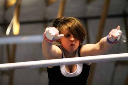 Kingston’s Megan Kelly reaches for the top bar during practice at Zero Gravity Athletics Monday afternoon. Kelly is one of two athletes from Kingston High School to have competed at State during the 2010-11 season.