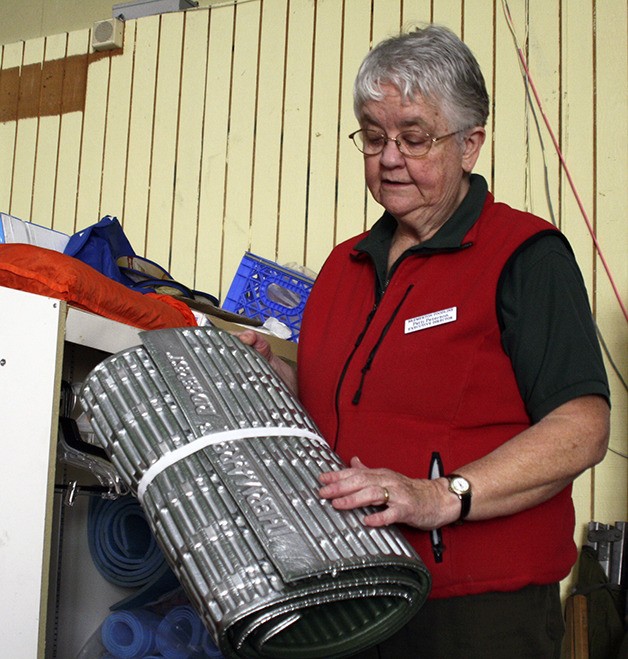 Bremerton Foodline Executive Director Patti Peterson displays a bed roll used at the extreme weather shelter.