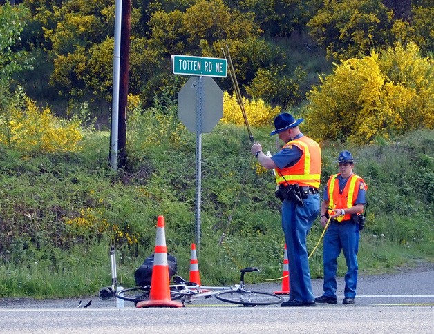 Troopers with the Washington State Patrol conduct an investigation into the collision between a cyclist and a Kitsap Transit bus that occurred around 6:30 a.m. on May 7.