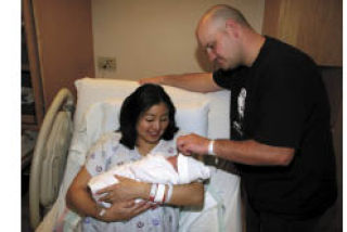 Lisa and Master-at-Arms Second Class David T. Vally are the proud parents of Naval Hospital Bremerton’s first baby of 2009