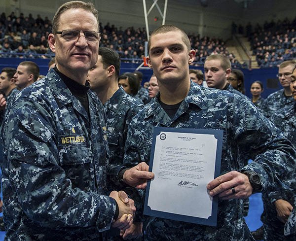 Religious Program Specialist 3rd Class Kyle Gerg is frocked by Capt. Mike Wettlaufer