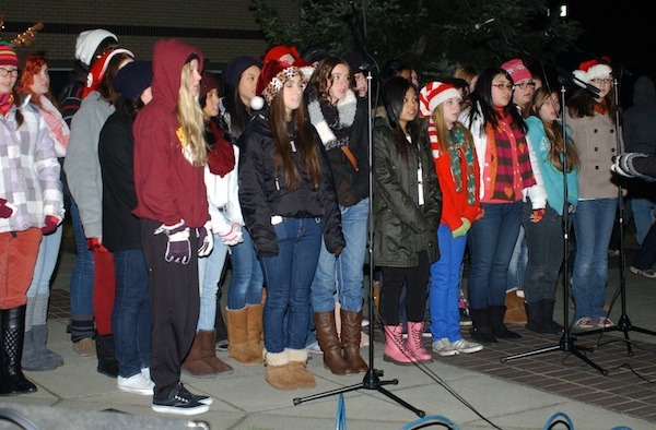 The Marcus Whitman Junior High School choir sing in front of City Hall during the Festival of Chimes and Lights on Dec. 7.