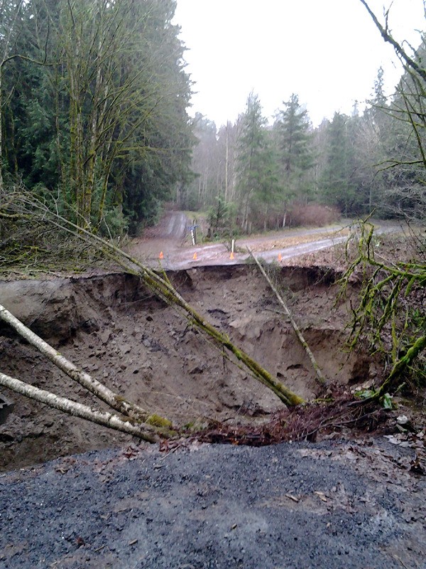 The entrance to roads leading to several homes on Bond Road north of Poulsbo washed out in a recent storm. The wash-out left behind a 20-foot hole and is forcing residents to use alternate routes to get to and from their homes.