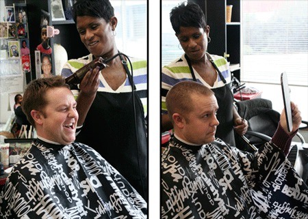 Bremerton High School boys basketball coach Casey Lindberg received a buzz cut at T Jz Gear & Trim in Bremerton on Thursday. Lindberg fulfilled his end of a bet