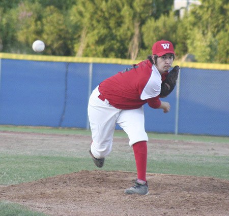 West Puget Sound pitcher Mike Shockey throws a pitching during the second inning of an 18-0 loss against Thousand Oaks