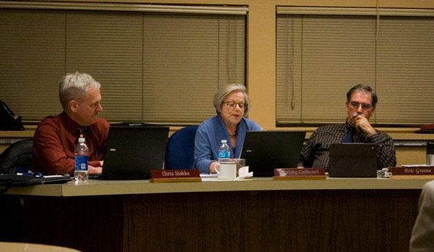 School board member Christy Cathcart reads her letter of resignation during Wednesday's public meeting. Cathcart served on the board from 1999 to 2013.