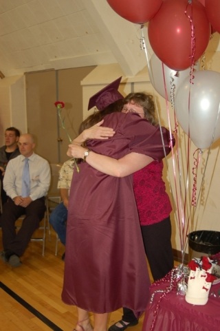 Renaissance High School graduate Kayln Andersen hugs Jenny Henderson