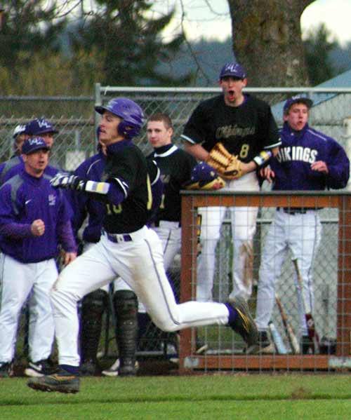 Alex Nettleton sprints to the home plate for the Vikings second point of the game.