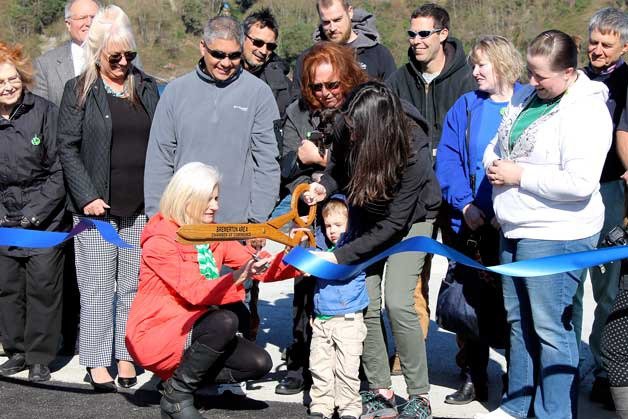 The ribbon is cut celebrating the completion and opening of the new boat launch at Evergreen Rotary Park in Bremerton on March 17.