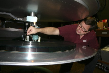 Firehouse Theater owner Craig Smith loads 'Avatar' onto his main screen projector. The theater is located in Kingston.