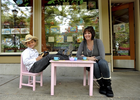 Michelle Lanning and her 7-year-old son Tyler take a break at Lil Sprouts Toy Shop