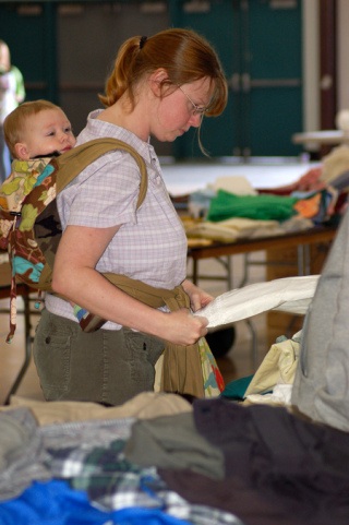 Becky Chambers sorts through some of the items available at the RAGS event April 18 while her son