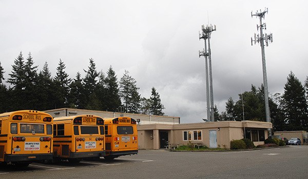 Buses sit parked at the Central Kitsap School District transportation facility along NW Ballard Lane in Silverdale March 23. The main building was built in 1977. In August