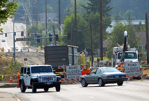 Motorists make their way around the closed Bucklin Bridge in Silverdale on the morning of July 8.