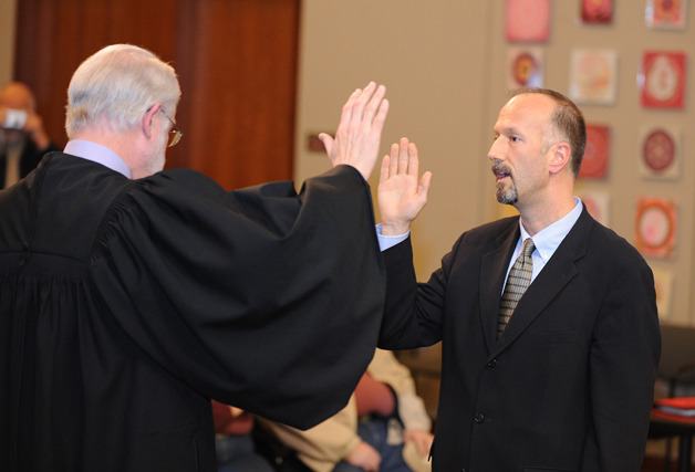 Rob Gelder is sworn in as the District 1 county commissioner by Superior Court Judge Jay Roof Monday in Port Orchard.