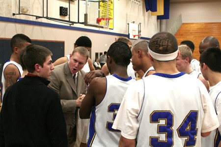 Bremerton High School boys basketball head coach Darren Bowden rallies his team during a Dec. 7 game against North Kitsap High School. Bowden