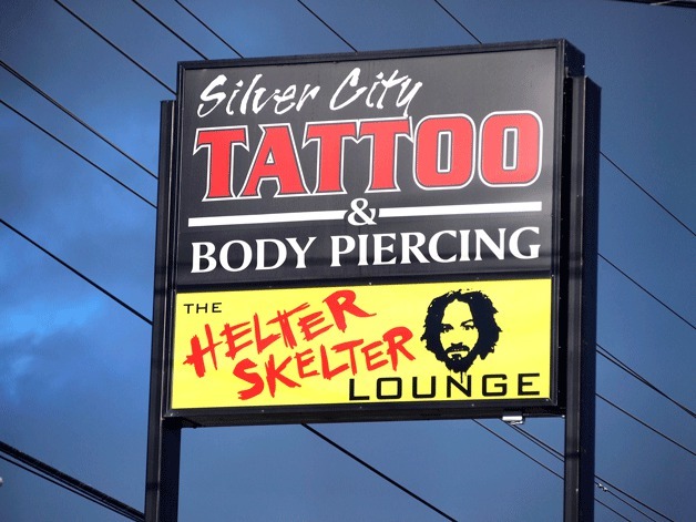 The sign for the Helter Skelter Lounge on Poulsbo's Viking Avenue has drawn criticism for its use of Charles Manson's image.