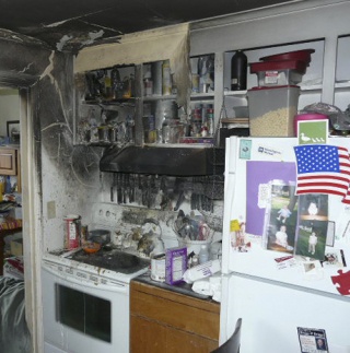 A man and his two children evacuated their home when food atop a stove caught fire in the kitchen.