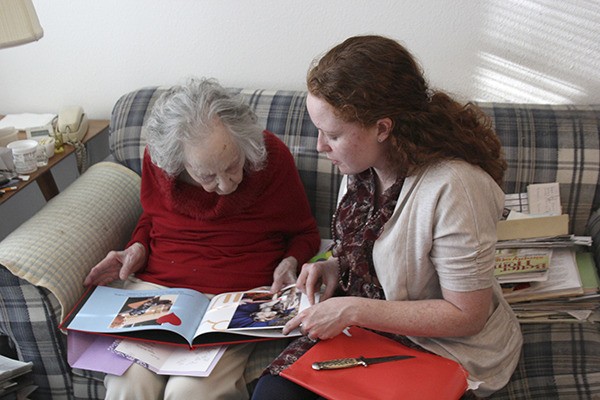 Almeda Harris  Wilson receives a scrapbook from KHS staff.