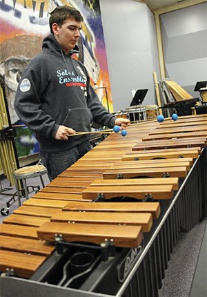 Central Kitsap High School senior Andrew Samuelson practices on a 5-octave marimba. Samuelson will be competing at the state level on the instrument later this month.