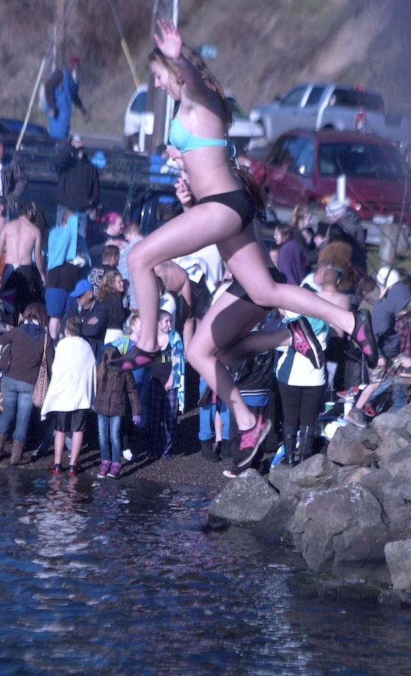 Several hundred people — of all ages — took part in the annual Olalla Polar Bear Jump on Jan. 1 at the Olalla Bay Bridge. Temperatures were around 40 at the noon start.