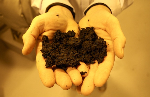 West Sound Utility District Plant Manager John Poppe displays a sample of Class B biosolid from the district's Port Orchard treatment center Friday.