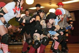 SCRV's Darth Maul Her (second from right) of the Death Rattle Rollers and A. Cup Killer (right) of the Terrormedixxx face off in a recent bout.