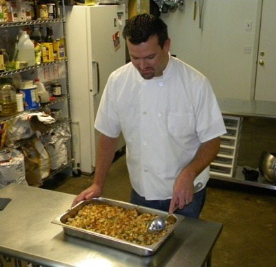 Essence of the Thymes co-owner Ray Allwine prepares holiday stuffing.