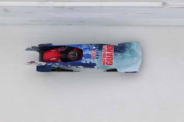 Dakarai Kongela and Jake Peterson race in a two-man bobsled. Kongela