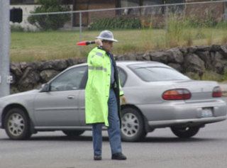 A Washington State Patrol trooper directs traffic Thursday afternoon at the intersection of Bethel and Sedgwick roads during the second power outage in South Kitsap in two days.