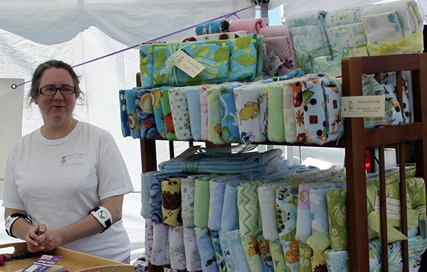 Daphne Jasinski in her booth at the Silverdale Farmers Market where she sells items she's sewn.