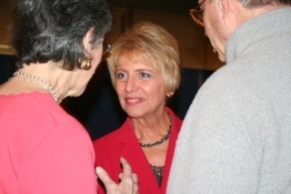 Jan Angel greets well-wishers during a celebration Tuesday night at Amy's by the Bay in Port Orchard.